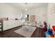 Bright playroom featuring white furniture and storage, wood floors, neutral rug and bright natural lighting at 1590 Branthaven Ln, Auburn, GA 30011