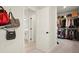 Open doorway to the walk-in closet which features custom shelving and ample storage at 1590 Branthaven Ln, Auburn, GA 30011