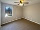 Bright bedroom with carpet, a window overlooking street and ample space at 25 Cloud Forest Ct, Stockbridge, GA 30281
