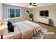 Bright bedroom with a large window and comfortable furnishings at 25 Cloud Forest Ct, Stockbridge, GA 30281