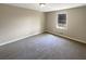 Neutral bedroom with carpet, a window and plenty of space at 25 Cloud Forest Ct, Stockbridge, GA 30281