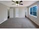 Large primary bedroom features plush carpet and ample natural light at 25 Cloud Forest Ct, Stockbridge, GA 30281