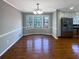 Charming dining area with hardwood floors, natural light, and stainless steel appliances at 25 Cloud Forest Ct, Stockbridge, GA 30281