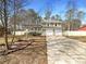 Charming two-story home featuring a well-manicured front yard and an attached two-car garage at 25 Cloud Forest Ct, Stockbridge, GA 30281