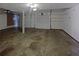 Spacious three-car garage with ample room for vehicles and storage at 25 Cloud Forest Ct, Stockbridge, GA 30281