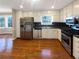 Well-lit kitchen with hardwood floors and stainless steel appliances at 25 Cloud Forest Ct, Stockbridge, GA 30281