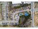 Aerial view of the community with a pool, tennis court, pond, and neighborhood streets at 1390 Napa Valley Sw Dr, Lawrenceville, GA 30045