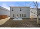The back exterior features a patio and level yard at 1390 Napa Valley Sw Dr, Lawrenceville, GA 30045