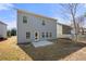 A home's backyard featuring a patio area and a green lawn next to a wooden fence at 1390 Napa Valley Sw Dr, Lawrenceville, GA 30045