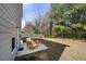Inviting backyard patio with seating, offering a relaxing outdoor space surrounded by a privacy fence at 1390 Napa Valley Sw Dr, Lawrenceville, GA 30045