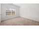 Carpeted bedroom with a large window at 1390 Napa Valley Sw Dr, Lawrenceville, GA 30045