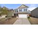 Charming two-story home with a well-manicured front yard and attached two car garage in a quiet neighborhood at 1390 Napa Valley Sw Dr, Lawrenceville, GA 30045