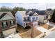 View of home exterior showing blue siding, garage, and landscaping at 1390 Napa Valley Sw Dr, Lawrenceville, GA 30045