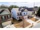 Two-story home with blue and brick exterior, attached garage, and manicured lawn at 1390 Napa Valley Sw Dr, Lawrenceville, GA 30045