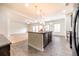 Open concept kitchen with stainless steel appliances and granite countertops at 1390 Napa Valley Sw Dr, Lawrenceville, GA 30045