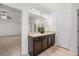 Bathroom with double sinks, granite countertops, and decorative lighting at 1390 Napa Valley Sw Dr, Lawrenceville, GA 30045