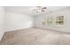 Spacious carpeted main bedroom with trey ceiling and a ceiling fan at 1390 Napa Valley Sw Dr, Lawrenceville, GA 30045
