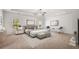 A spacious main bedroom featuring a king bed, white walls, and ample natural light at 1390 Napa Valley Sw Dr, Lawrenceville, GA 30045