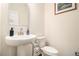 Elegant half bathroom features a pedestal sink and updated fixtures at 182 Broder Farms Dr, Stockbridge, GA 30281
