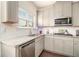 Open concept eat in kitchen with a kitchen island, stainless appliances and seamless flow to the living spaces at 182 Broder Farms Dr, Stockbridge, GA 30281