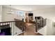 Upstairs living area featuring wood floors, a chandelier, and a cozy seating area at 182 Broder Farms Dr, Stockbridge, GA 30281