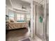 Main bathroom showcasing a glass enclosed shower, and a large bedroom area at 182 Broder Farms Dr, Stockbridge, GA 30281