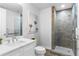 Modern bathroom with a glass-door shower and a vanity with marble countertop at 270 17Th Nw St # 3905, Atlanta, GA 30363