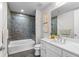 Bathroom featuring a shower-tub combination and a vanity sink with marble countertop at 270 17Th Nw St # 3905, Atlanta, GA 30363