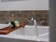 Relaxing bathroom with a soaking tub, stylish tile, and a convenient wooden bath tray at 270 17Th Nw St # 3905, Atlanta, GA 30363