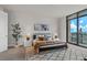 Cozy bedroom with a full bed and a large window offering city views at 270 17Th Nw St # 3905, Atlanta, GA 30363
