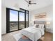 Comfortable bedroom with a queen bed and a large window offering city views at 270 17Th Nw St # 3905, Atlanta, GA 30363