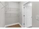 Walk-in closet with white wire shelving and neutral paint at 270 17Th Nw St # 3905, Atlanta, GA 30363