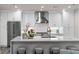 Bright kitchen with white cabinetry, stainless steel appliances, and an island with seating and modern finishes at 270 17Th Nw St # 3905, Atlanta, GA 30363