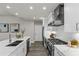 Kitchen featuring white cabinets, stainless steel appliances, and a marble island with seating at 270 17Th Nw St # 3905, Atlanta, GA 30363