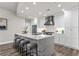 Bright kitchen with white cabinetry, stainless steel appliances, and an island with bar seating and modern finishes at 270 17Th Nw St # 3905, Atlanta, GA 30363