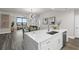 Open floor plan with kitchen featuring stainless steel appliances and marble island at 270 17Th Nw St # 3905, Atlanta, GA 30363