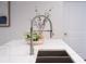 Modern kitchen island with a stainless steel faucet and a sink at 270 17Th Nw St # 3905, Atlanta, GA 30363