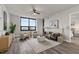 Bright, open living room featuring modern furniture, large windows, and wood flooring at 270 17Th Nw St # 3905, Atlanta, GA 30363