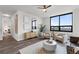Bright living room featuring a ceiling fan and a large window with cityscape view at 270 17Th Nw St # 3905, Atlanta, GA 30363