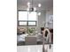 Bright living room with modern lighting fixture and neutral furniture at 270 17Th Nw St # 3905, Atlanta, GA 30363