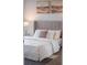 Comfortable main bedroom features plush bedding and a neutral color palette at 270 17Th Nw St # 3905, Atlanta, GA 30363