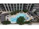 Aerial view of a luxury condo pool with a sundeck and beautifully landscaped area at 270 17Th Nw St # 3905, Atlanta, GA 30363