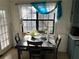 Bright kitchen nook with a window, table, and chairs, perfect for casual dining at 944 Pine Ridge Dr, Stone Mountain, GA 30087