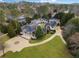 Aerial shot of the expansive property highlighting the stately home, circular driveway and mature landscaping at , Roswell, GA 30075