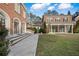 Large brick home with a manicured lawn at , Roswell, GA 30075