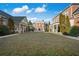 Large backyard featuring lush landscaping and a beautiful brick home at , Roswell, GA 30075