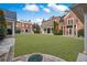 Expansive backyard with lush lawn and stately brick home at , Roswell, GA 30075