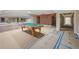Finished basement with a pool table, mirrored wall, and an arched brick alcove at , Roswell, GA 30075