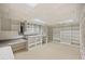 Finished basement includes built-in shelving, desk area, and ample storage space at , Roswell, GA 30075