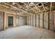 Unfinished basement space showing exposed framing, ductwork, and concrete flooring, ready for customization at , Roswell, GA 30075